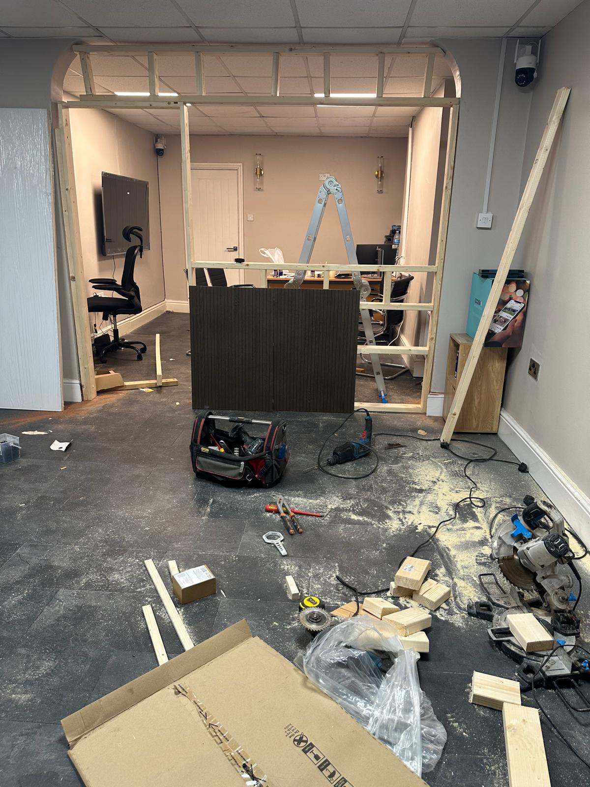 Partition wall framing and first-fit work inside a property